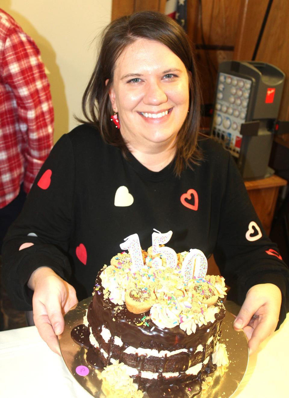 Stephanie Lambert's first-place tie cake and Best of Show overall called "Have Your Cake and Cookies Too," celebrating Meyersdale's 150th sesquicentennial this year, was sold for $145 to Nancy Griffith at the Death By Chocolate auction in Meyersdale on Friday evening.