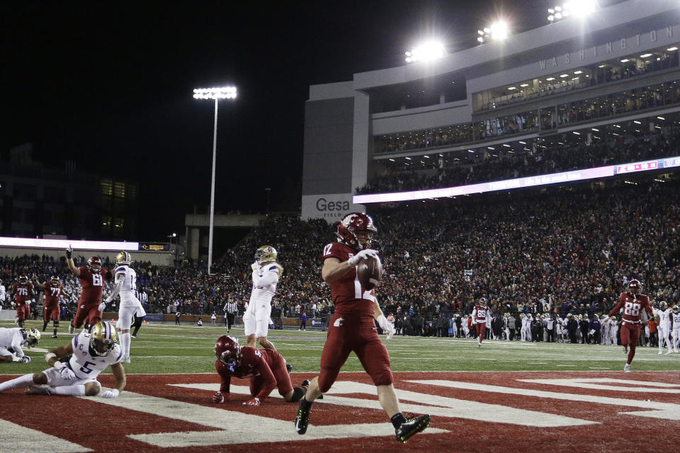 Washington State wide receiver Robert Ferrel (12) runs for a touchdown during the first half of an NCAA college football game against Washington, Saturday, Nov. 26, 2022, in Pullman, Wash. (AP Photo/Young Kwak)