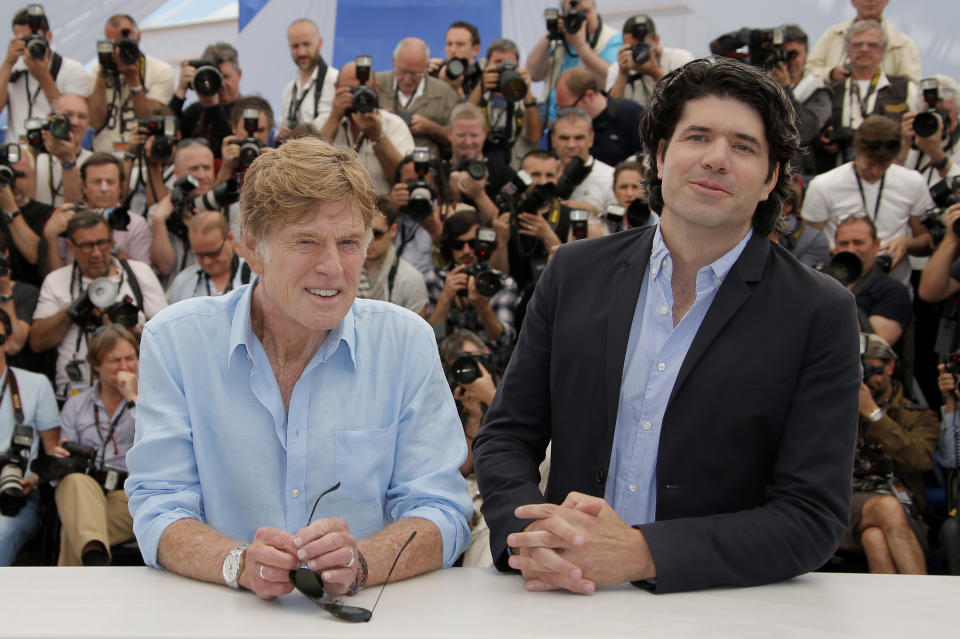 Actor Robert Redford, left, and director J.C. Chandor pose for photographers during a photo call for the film All Is Lost at the 66th international film festival, in Cannes, southern France, Wednesday, May 22, 2013. (AP Photo/Francois Mori)