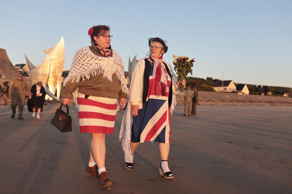 World War II reenactors gather on Omaha Beach during a D-Day commemoration ceremony of the 78th anniversary for those who helped end World War II, in Saint-Laurent-sur-Mer, Normandy, France, Monday, June 6, 2022. (AP Photo/Jeremias Gonzalez)