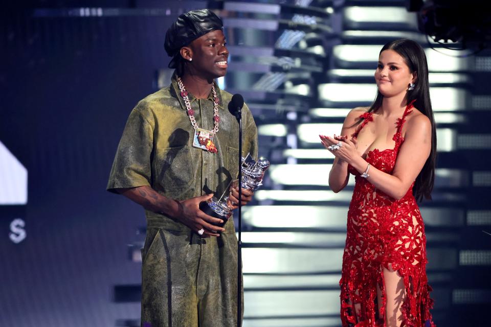 Rema and Selena Gomez accept the best Afrobeats award for "Calm Down" at the 2023 MTV VMAs.