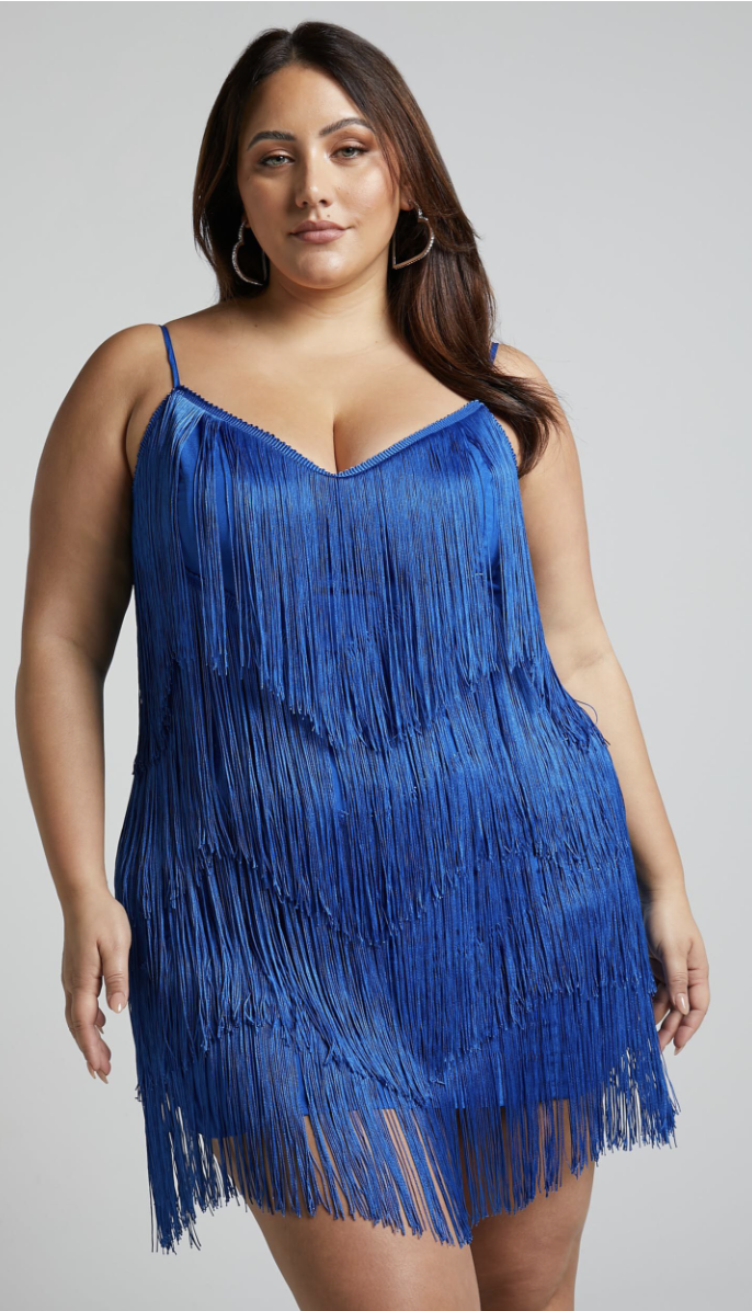 model wearing blue sleeveless fringe dress