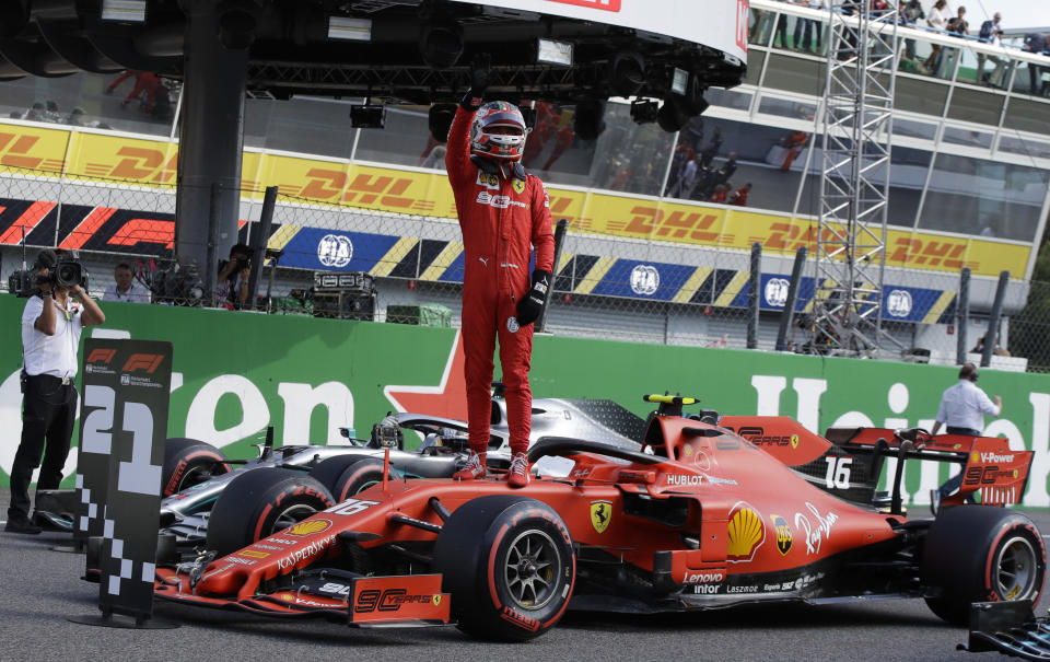 Ferrari driver Charles Leclerc of Monaco celebrates taking pole position during the qualifying session at the Monza racetrack, in Monza, Italy, Saturday, Sept. 7, 2019. The Formula one race will be held on Sunday. (AP Photo/Luca Bruno)