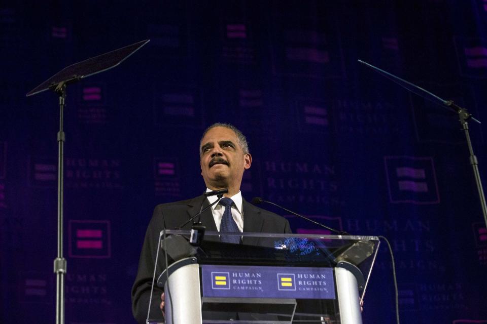 United States Attorney General Eric Holder speaks during the Human Rights Campaign's 13th annual Greater New York Gala in the Manhattan borough of New York, February 8, 2014. Holder plans widespread changes within the U.S. Justice Department to benefit same-sex married couples, such as recognizing a legal right for them not to testify against each other in civil and criminal cases. REUTERS/Keith Bedford (UNITED STATES - Tags: POLITICS CRIME LAW)