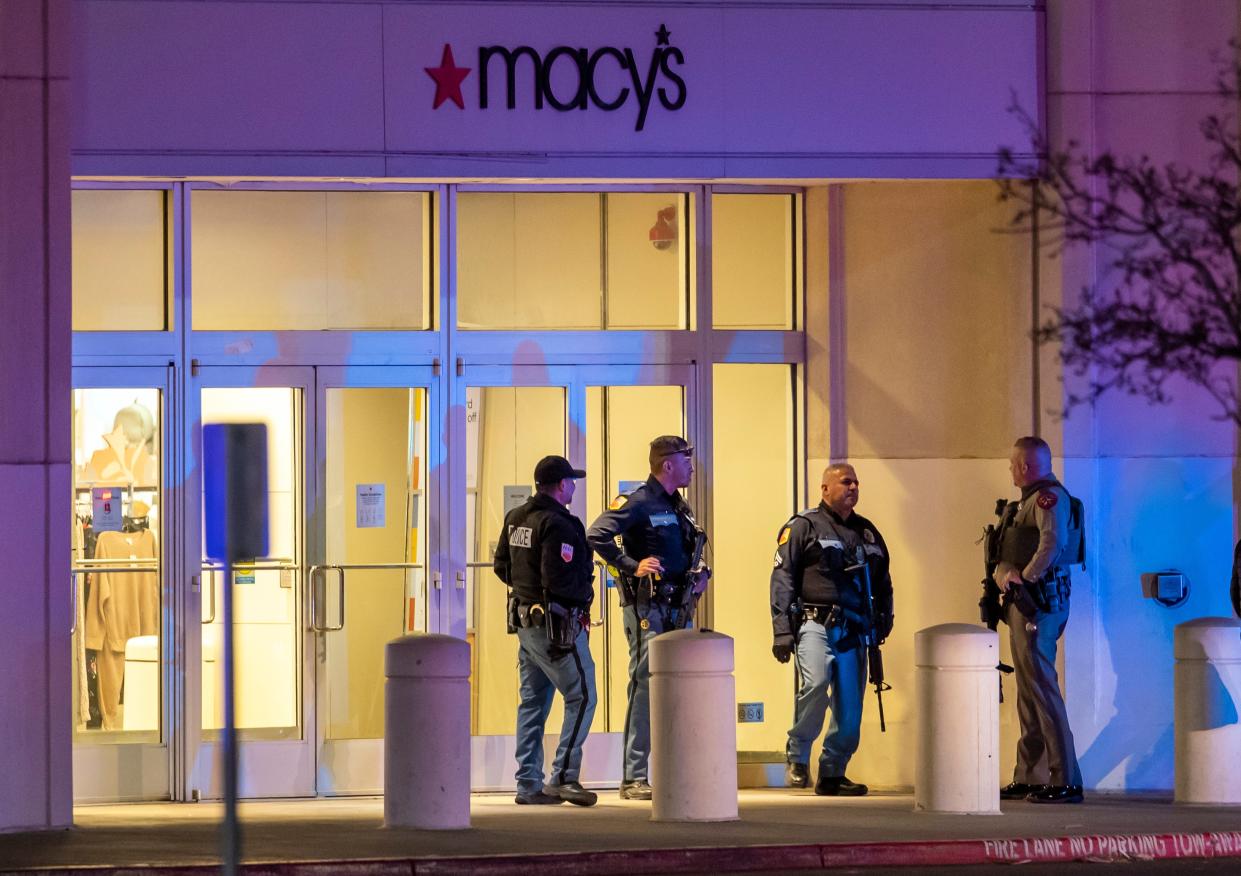 Police officers stand guard at an entrance of a shopping mall, Wednesday, Feb. 15, 2023, in El Paso, Texas (AP)