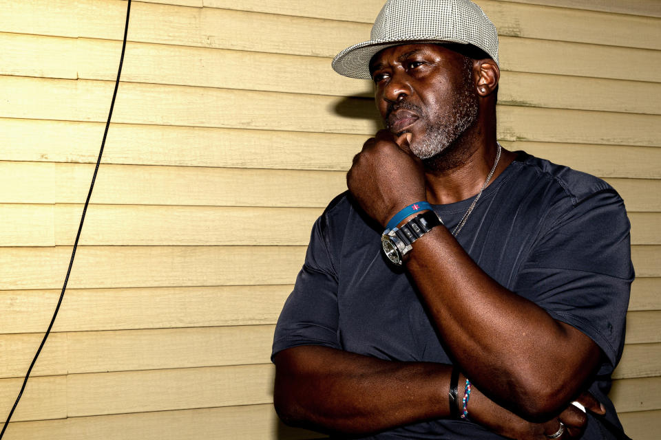 Harold Lewis, a recovering drug user, stands for a portrait outside his mother's house, Tuesday, July 19, 2022 in Stratford, Conn. Lewis moved back in with his mother and older sister several months earlier. (AP Photo/Julia Nikhinson)