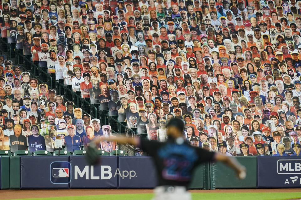 Miami Marlins Sandy Alcantara delivers a pitch in front of cut-outs of fans during the seventh inning in Game 1 of a baseball National League Division Series against the Atlanta Braves Tuesday, Oct. 6, 2020, in Houston. (AP Photo/Eric Gay)