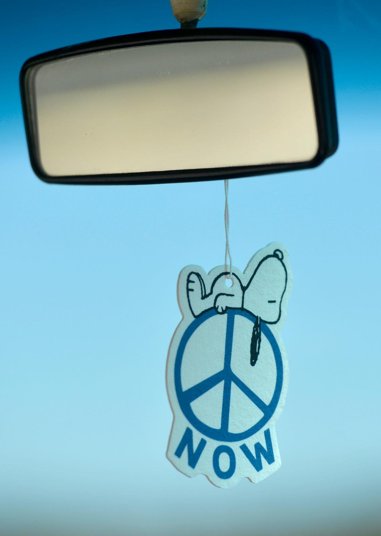 A Snoopy air freshener hangs from the rear view mirror in the VW bus. Jim and Denise Pressman are opening their own mobile coffee company, Press Ahead Coffee, out of a 1977 Volkswagen bus.
