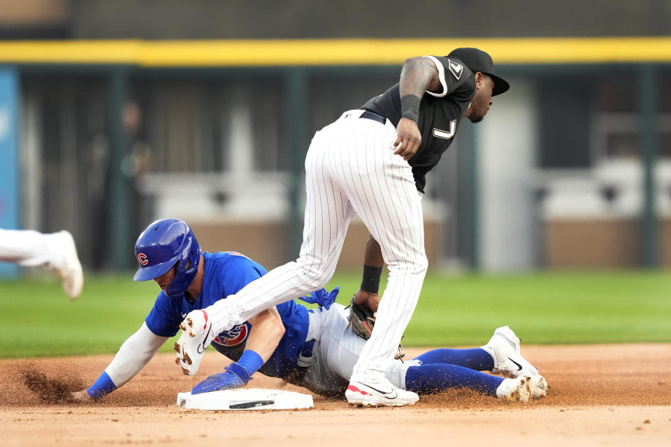 Chicago Cubs' Nico Hoerner steals second as Chicago White Sox shortstop Tim Anderson applies the tag during the first inning of a baseball game Tuesday, July 25, 2023, in Chicago. (AP Photo/Charles Rex Arbogast)