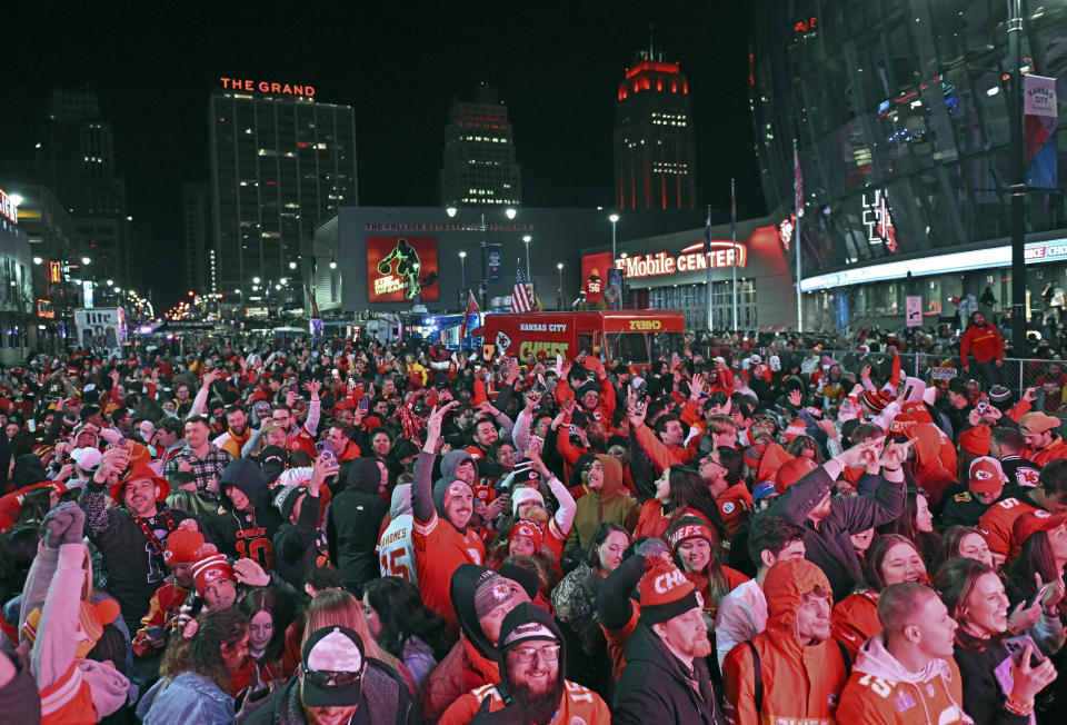 Kansas City Chiefs fans celebrate after the Chiefs scored the winning touchdown in overtime to beat the San Francisco 49ers, during a Super Bowl 58 watch party at the Power and Light District Sunday, Feb. 11, 2024, in Kansas City, Mo. (AP Photo/Peter Aiken)