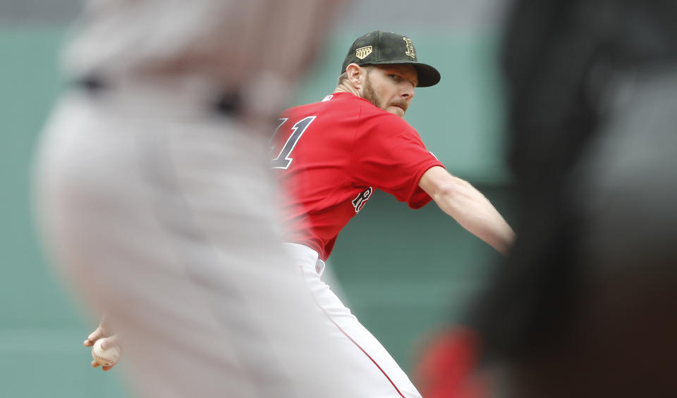 Boston Red Sox starting pitcher Chris Sale delivers against the Houston Astros during the first inning of a baseball game Sunday, May 19, 2019, at Fenway Park in Boston. (AP Photo/Winslow Townson)