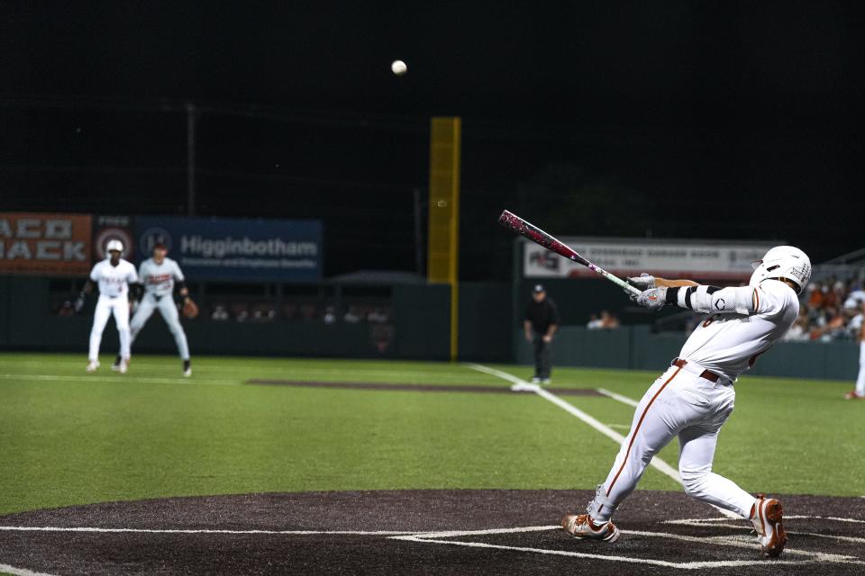 Texas catcher Rylan Galvan (6) hits a ball during the game against Oklahoma State at UFCU Disch–Falk Field on Friday, May. 3, 2024 in Austin.
