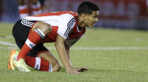 River Plate's Teofilo Gutierrez gets up during an Argentine league soccer match against Velez Sarsfield in Buenos Aires, Argentina, Sunday, April 20, 2014. (AP Photo/Natacha Pisarenko)