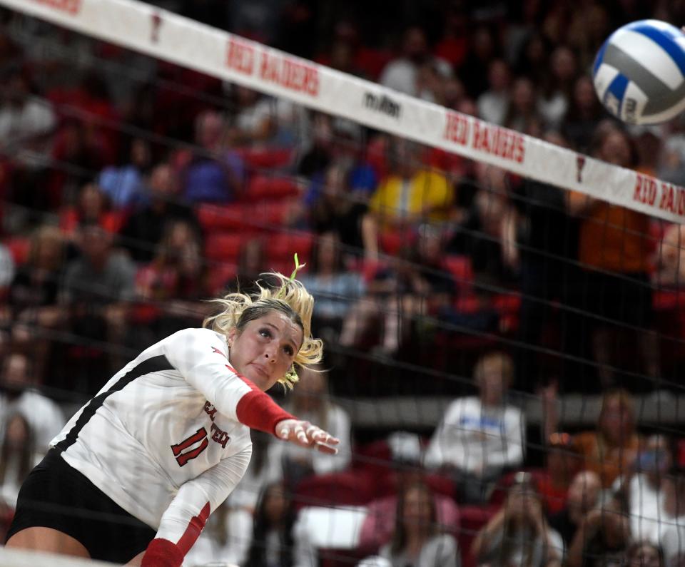 Texas Tech's Kenna Sauer hits the ball against Texas in a Big 12 volleyball match, Sunday, Oct. 2, 2022, at United Supermarkets Arena.