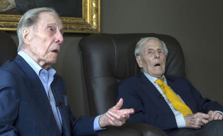 The world's oldest living twin brothers, Paulus and Pieter Langerock from Belgium, 102, sit in their living room at the Ter Venne care home in Sint-Martens-Latem, Belgium, August 11, 2015. REUTERS/Yves Herman