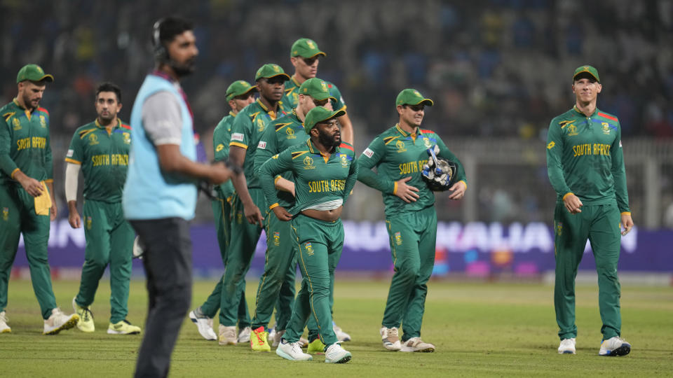 South Africa's captain Temba Bavuma with teammates walk off the field after losing to Australia by 3 wickets during the ICC Men's Cricket World Cup second semifinal match in Kolkata, India, Thursday, Nov.16, 2023. (AP Photo/Aijaz Rahi)