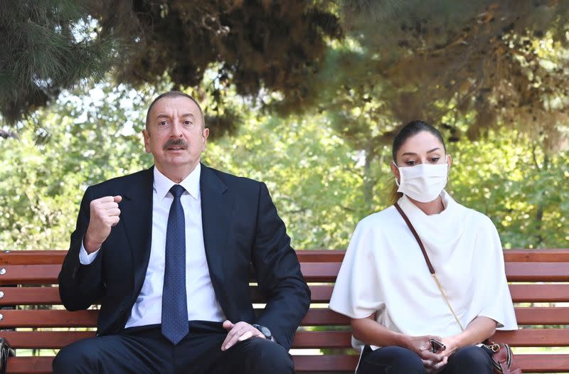 Azerbaijan's President Ilham Aliyev and his wife Mehriban meet with service members wounded during clashes over the breakaway region of Nagorno-Karabakh in Baku