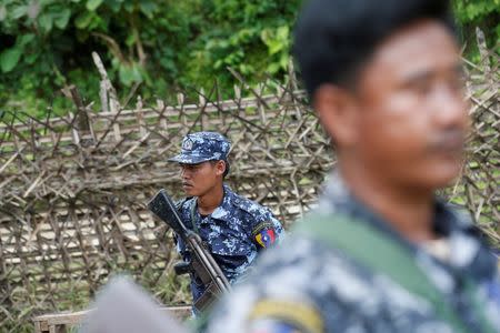 Polices guard near a bridge after Arakan Rohingya Salvation Army (ARSA) attacked, in Buthidaung, Myanmar August 28, 2017. RETUERS/Soe Zeya Tun/Files