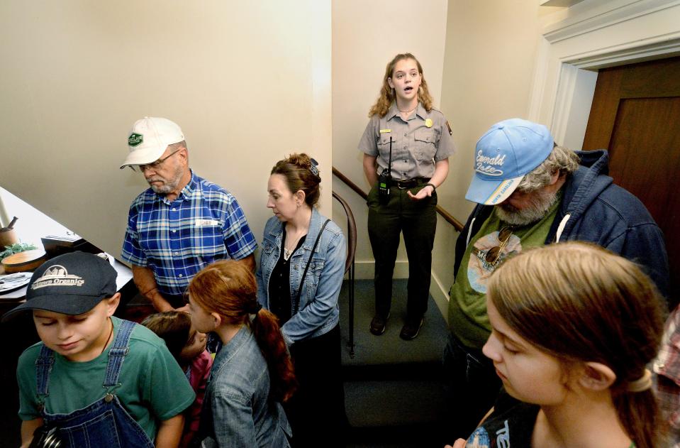 Park Guide Ashley Parsons, center, gives a tour of Lincoln's home in Springfield Wednesday, Sept. 27, 2023. Parsons is one of the many workers who will be effected if there is a government shutdown.