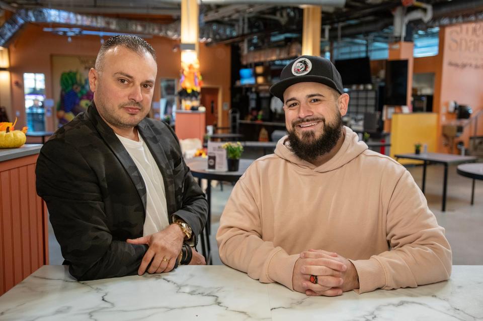 Julio C. Roque, left, and Kevin Comellas at the Worcester Public Market ahead of the opening of Little Havana.