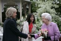 <p>The Queen meets Yvonne Innes (left), the designer of the show garden From Life to Life, A garden for George, created to celebrate the life of George Harrison of the Beatles. The Queen also met Olivia Harrison (centre), widow of George, during her visit to RHS Chelsea in 2008.</p>