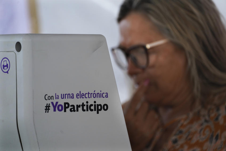 A woman casts her ballot during the local state elections in Cuautitlán Izcalli, Mexico state, Mexico, Sunday, June 4, 2023. (AP Photo/Marco Ugarte)