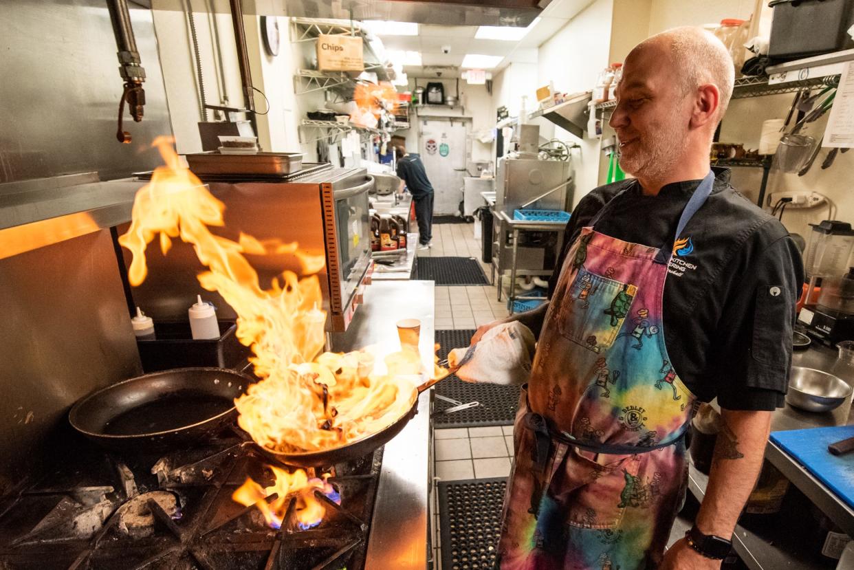 Chef Walt Marshall prepares a Fusion Kitchen favorite called Drunken Mussels, on Tuesday, April 16, 2024.