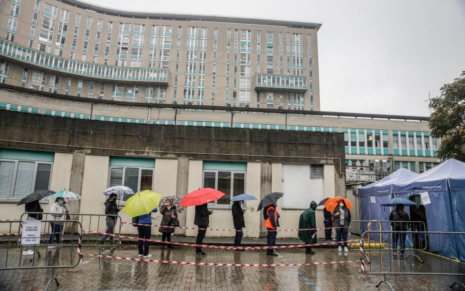 Italians queuing for Covid tests in Milan - Luca Bruno/AP