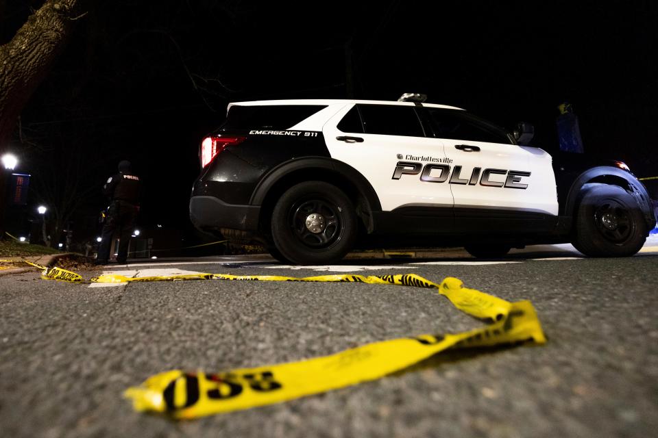 A Charlottesville Police vehicle is parked on Culbreath Road during an active shooter situation on the University of Virginia campus in Charlottesville, Va., on Monday, Nov. 14, 2022. Three people have been killed and two others were wounded in a shooting at a parking garage at the University of Virginia, according to the school’s president, and police searched Monday for a student who was a suspect.