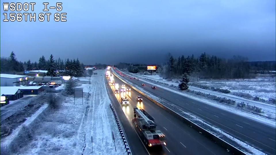 Washington State Department of Transportation cameras showed snow falling around Western Washington Wednesday.