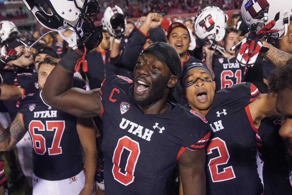 Utah linebacker Devin Lloyd (0) celebrates with teammates following their NCAA college football game against Arizona State Saturday, Oct. 16, 2021, in Salt Lake City. (AP Photo/Rick Bowmer)