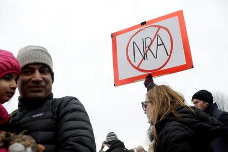 Students and gun control advocates attend the "March for Our Lives" event after recent school shootings, at a rally in Chicago, Illinois, U.S., March 24, 2018. REUTERS/Joshua Lott/Files