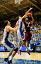 DURHAM, NC - JANUARY 21: Xavier Gibson #1 of the Florida State Seminoles shoots over Ryan Kelly #34 and Miles Plumlee #21 of the Duke Blue Devils during play at Cameron Indoor Stadium on January 21, 2012 in Durham, North Carolina. Florida State won 76-73 to end Duke's 44-game home winning streak. (Photo by Grant Halverson/Getty Images)