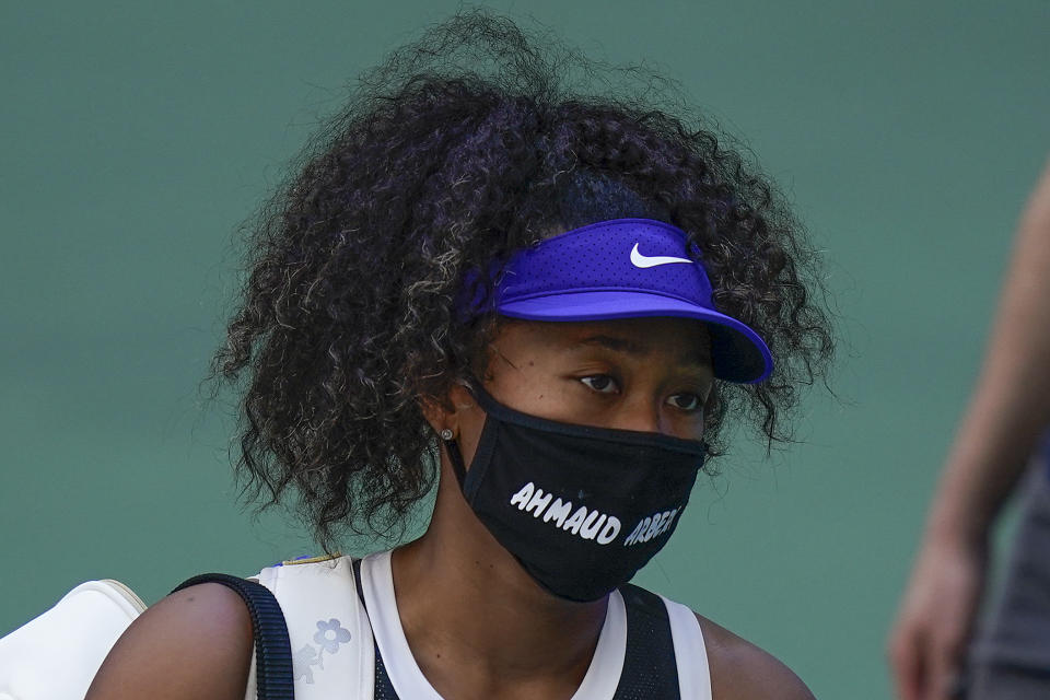 Naomi Osaka, of Japan, walks off the court after winning a match against Marta Kostyuk, of the Ukraine, during the third round of the US Open tennis championships, Friday, Sept. 4, 2020, in New York. (AP Photo/Seth Wenig)