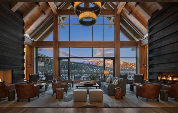 The lobby at the entrance to the hotel features the consistently impressive views of the mountains that surround it, as well as a deck off of it with firepits.