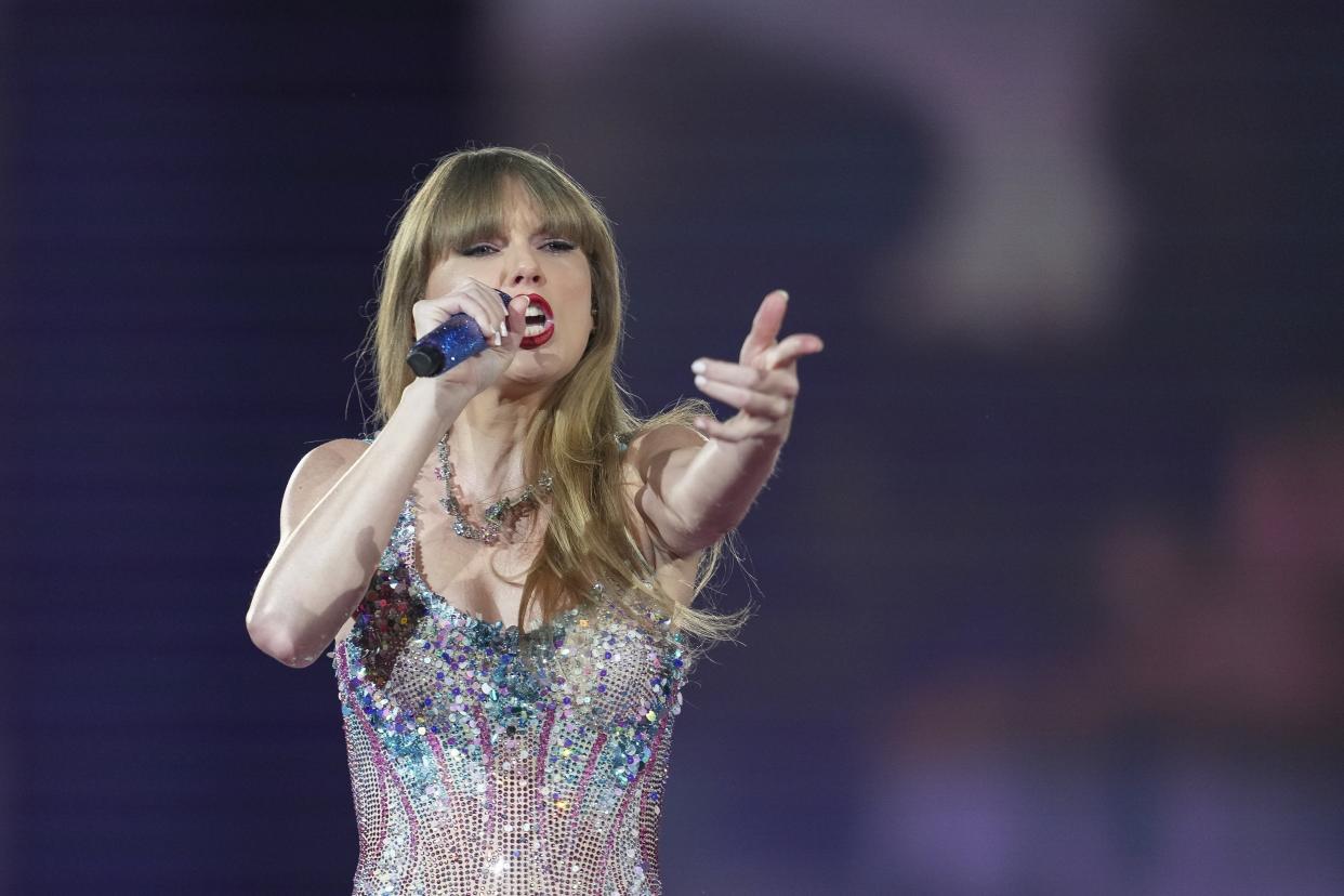 Taylor Swift performs at the Tokyo Dome. She's expected to arrive in Las Vegas in time for the Super Bowl.  (AP/Toru Hanai)