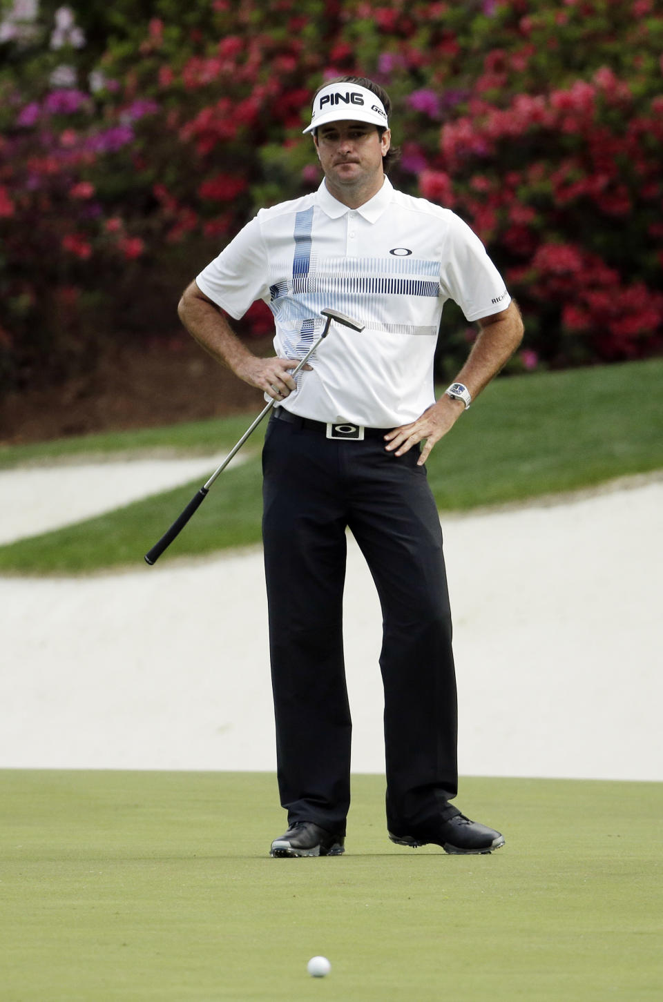 Bubba Watson looks at his ball after missing an eagle putt on the 13th green during the fourth round of the Masters golf tournament Sunday, April 13, 2014, in Augusta, Ga. (AP Photo/Chris Carlson)