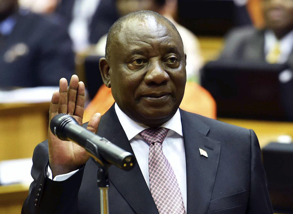 In this photo supplied by the South African Government Communications and Information Services (GCIS) Cyril Ramaphosa is sworn in as a member of parliament in Cape Town, South Africa, Wednesday, May 22, 2019. Ramaphosa has taken steps to crack down on corruption Wednesday as the country's new parliament voted him to lead the country for a five-year term. (Jairus Mmufle/Government Communications and Information Services via AP)