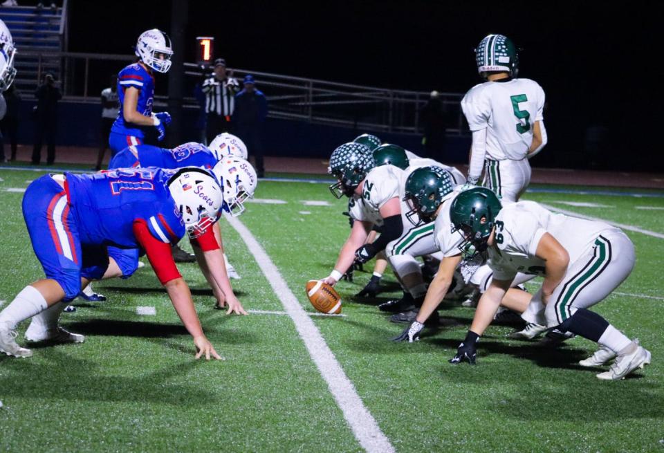 Highland's defense lines up against Tinora during Friday night's Division V, Region 18 playoff game at home.