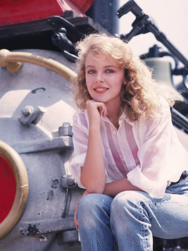 <em>Kylie Minogue poses with a locomotive (get it?) in 1988.</em><p>Chris Walter/Getty Images</p>