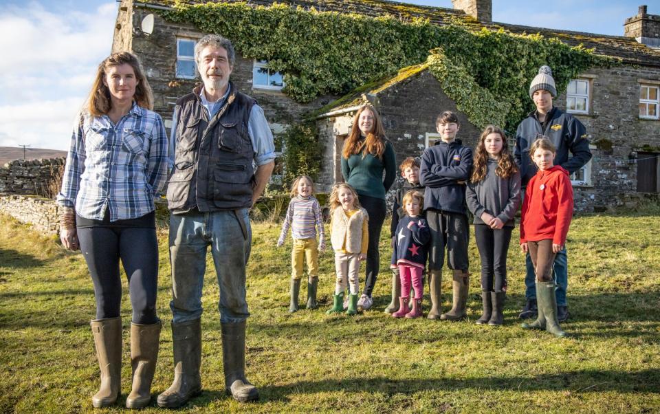 Amanda and Clive Owen with their children outside Ravenseat Farm - Channel 5