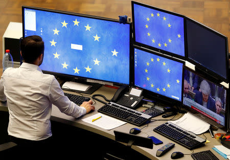 A share trader starts his trading systems at the start of the trading session the day after the Brexit deal vote of the British parliament at the stock exchange in Frankfurt, Germany, January 16, 2019. REUTERS/Kai Pfaffenbach
