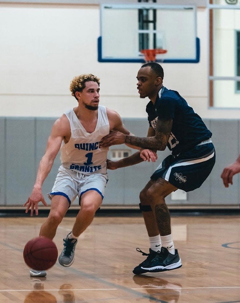 Quincy College's Doug Alves handling the ball.