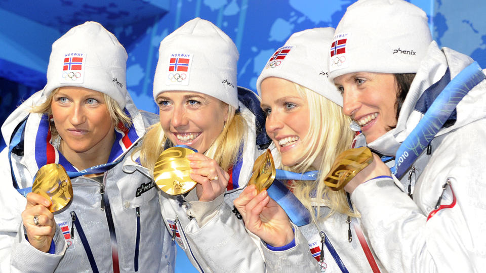 Norway’s gold medalists (L-R) Vibeke W Skofterud, Therese Johaug, Kristin Stoemer Steira and Marit Bjoergen attend the medal ceremony for the women’s Nordic Cross Country Skiing 4×5 km relay event at Whistler Medals Plaza during the Vancouver Winter Olympics on February 25, 2010. AFP PHOTO DDP / MICHAEL KAPPELER (Photo credit should read MICHAEL KAPPELER/AFP/Getty Images)