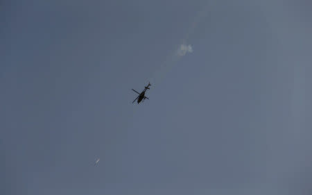 A helicopter fires weapons during clashes with Islamic State militants on the outskirts of Saqlawiya north of Falluja, Iraq, June 2, 2016. REUTERS/Thaier Al-Sudani