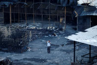 <p>A plainclothes police officer works at the site of an explosion at a fireworks factory at Kosambi village in Tangerang, Indonesia Banten province, Oct. 26, 2017. (Photo: Beawiharta/Reuters) </p>