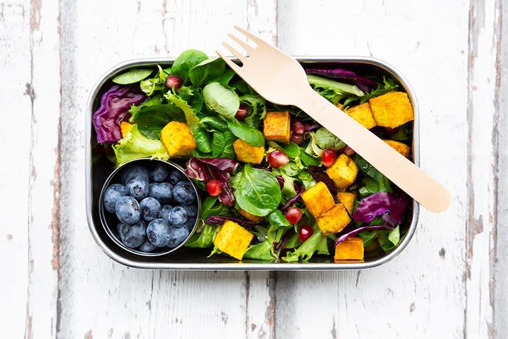 Meal prepped salad and fruit