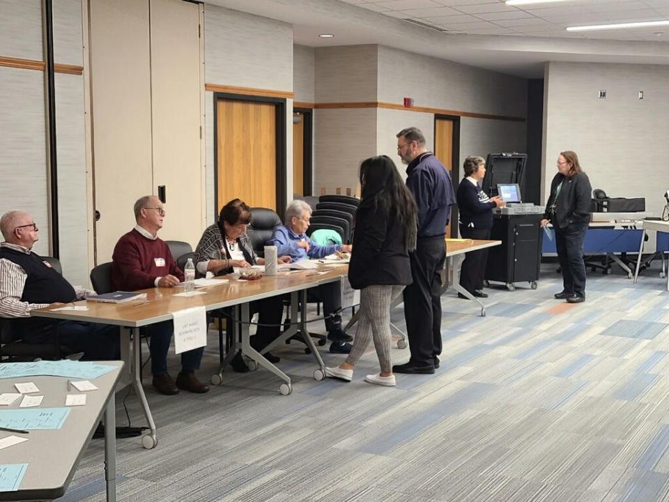 Election staff help voters at the Chambersburg Area School District Administration Building on Stanley Avenue in the borough on Tuesday evening, Election Day.