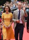 <p>Kate paid homage to the golden yellow of Germany's flag in a custom lace dress from royal favorite Jenny Packham. She paired the look with a small clutch and taupe espadrille wedges.</p>