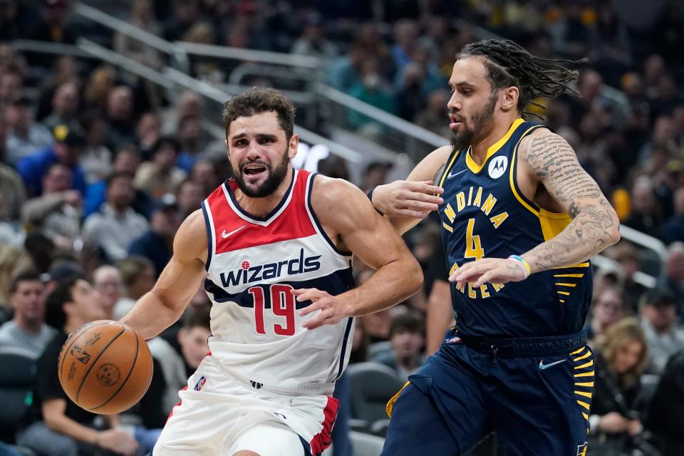 Washington Wizards' Raul Neto (19) goes to the basket against Indiana Pacers' Duane Washington Jr. (4) during the first half of an NBA basketball game, Wednesday, Feb. 16, 2022, in Indianapolis.